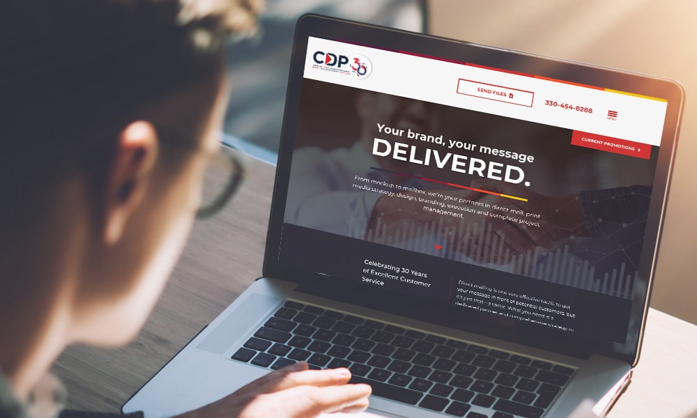 Young man working on his laptop with blank copy space screen for your advertising text message in office, Back view of business man hands busy using laptop at office desk